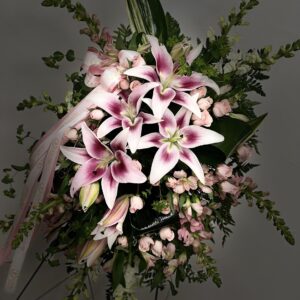 Light Pink Standing Spray oval funeral arrangement in pink and white flowers, symbolizing peace, love, and remembrance. A fitting tribute for a loved one’s life.